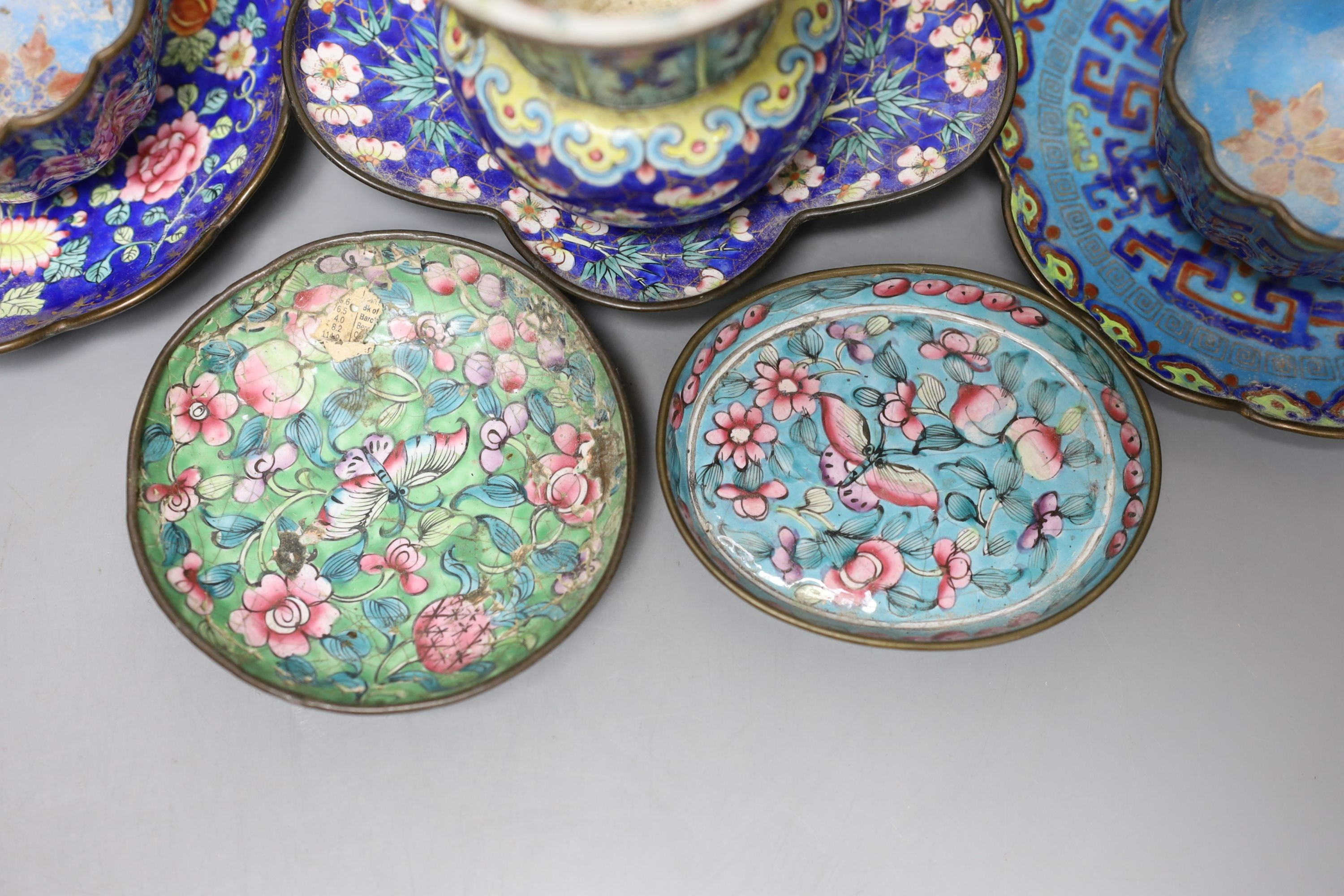 A group of 19th century Canton enamelled wares, including a vase and stand, two tea bowls and saucers and two dishes